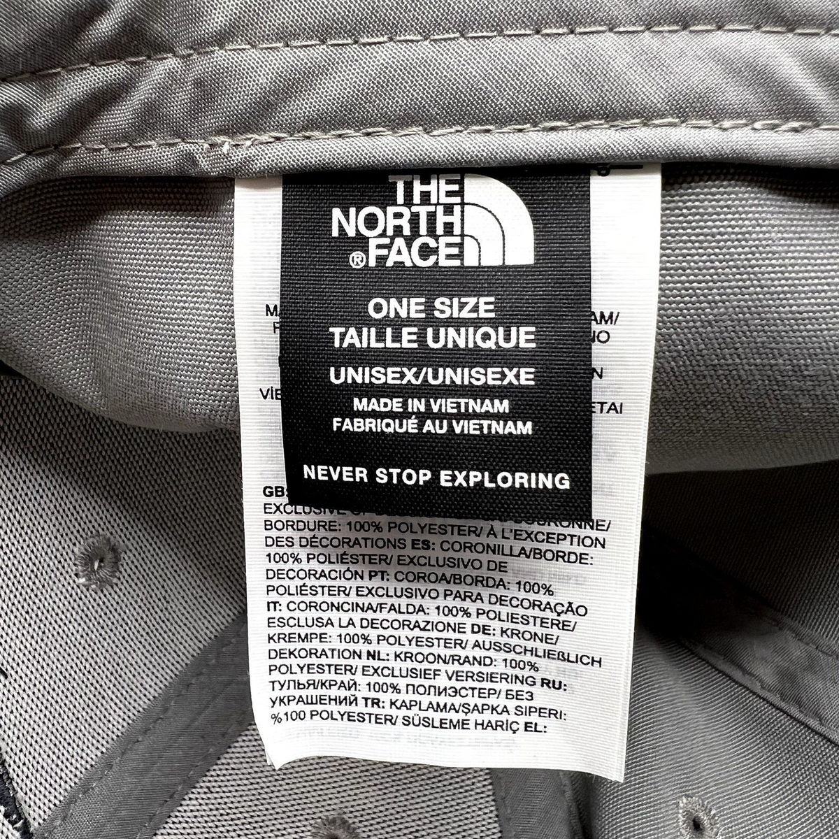 Raree Finds The North Face hat interior care label showing brand logo, size, and 100% polyester material details