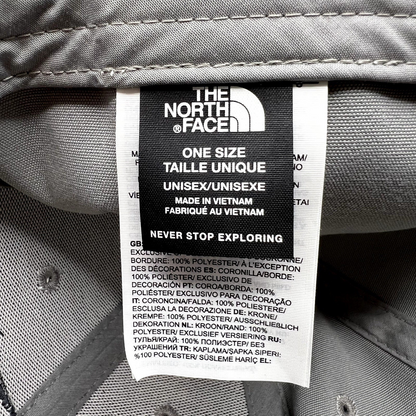 Raree Finds The North Face hat interior care label showing brand logo, size, and 100% polyester material details