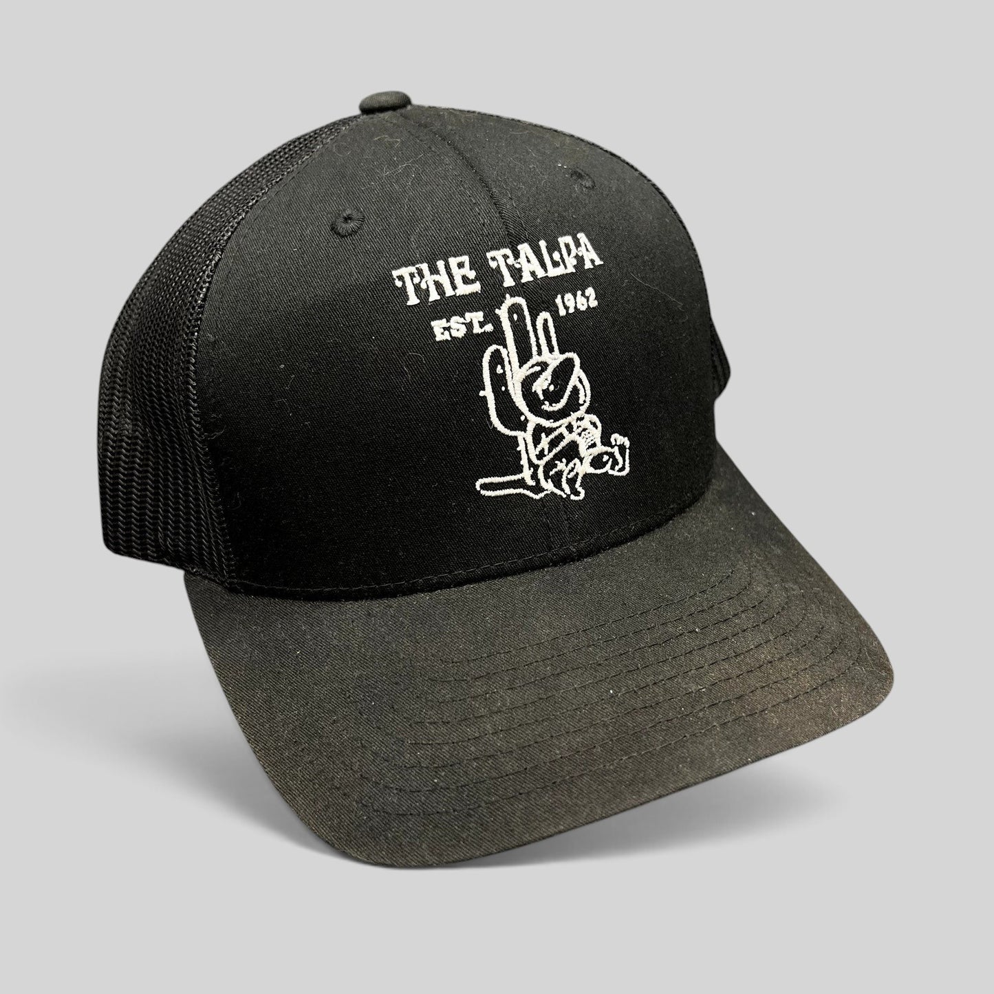 Raree Finds black Yupoong trucker snapback hat featuring The Talpa Est. 1962 embroidered cactus mascot logo