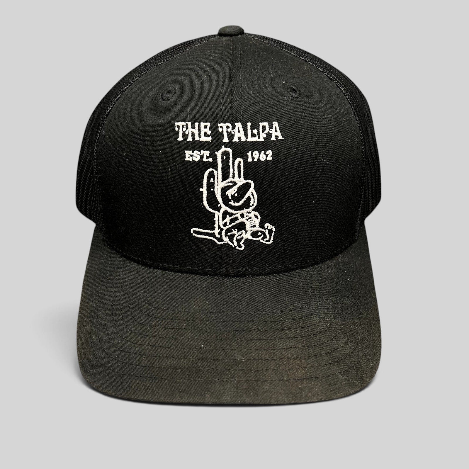 Raree Finds black Yupoong trucker snapback hat featuring The Talpa Est. 1962 embroidered cactus mascot logo