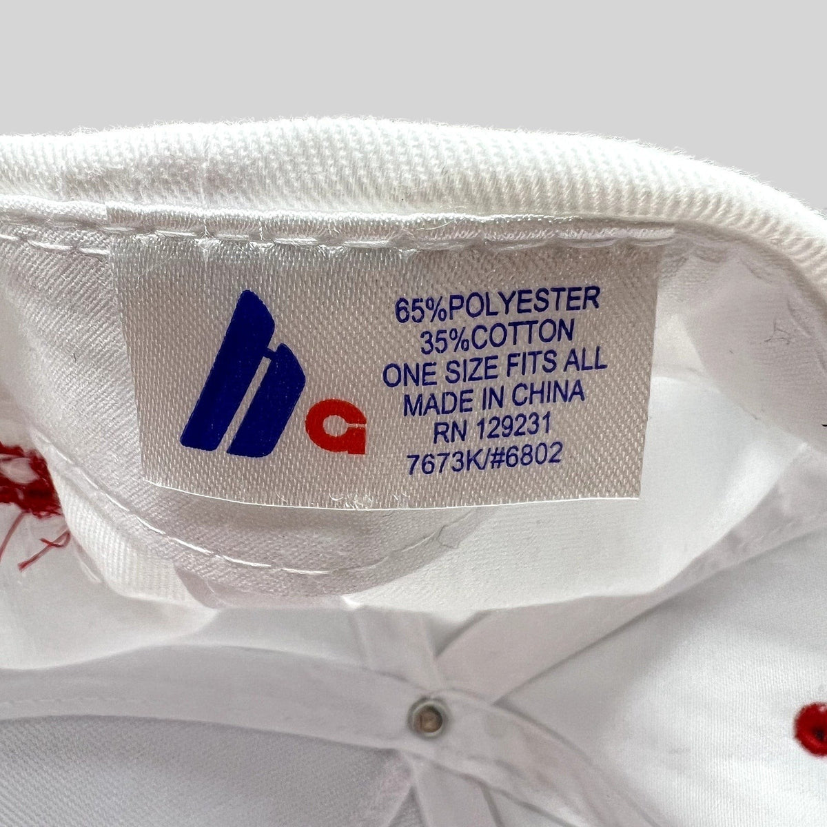 Raree Finds The Voice snapback hat interior fabric label showing material composition and manufacturing details