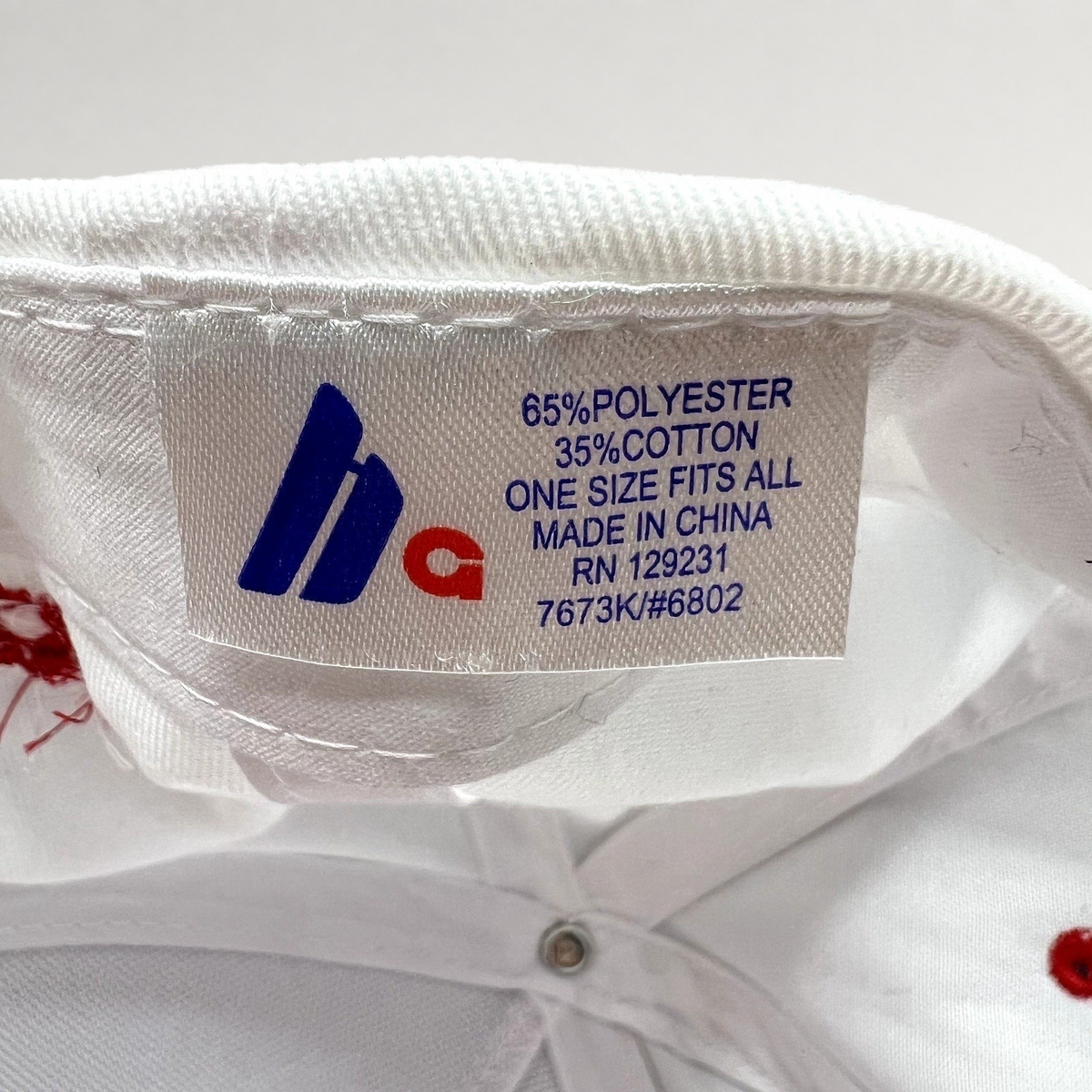 Raree Finds The Voice snapback hat interior fabric label showing material composition and manufacturing details