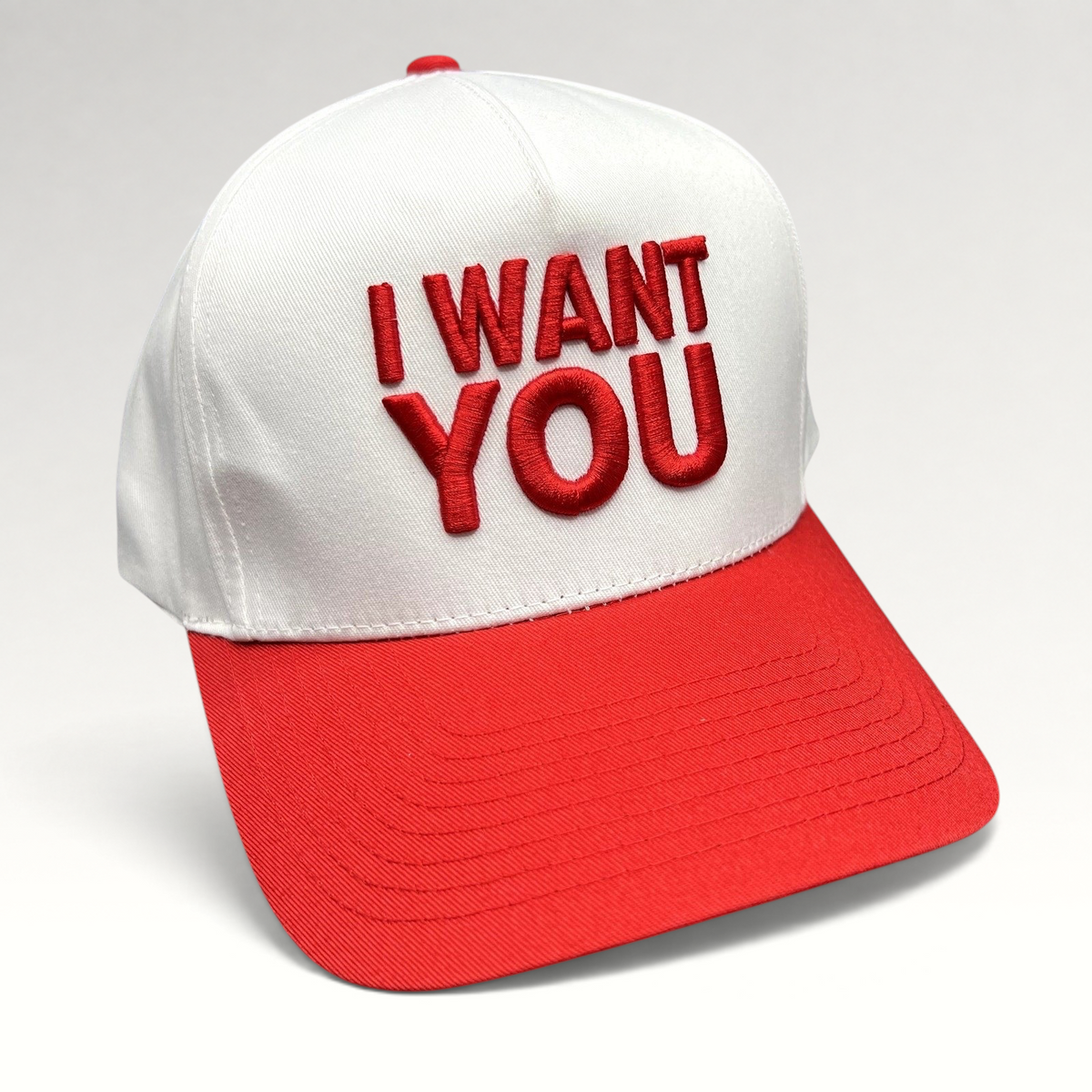 Raree Finds The Voice I Want You snapback hat with white crown, red brim, and bold red raised embroidery.