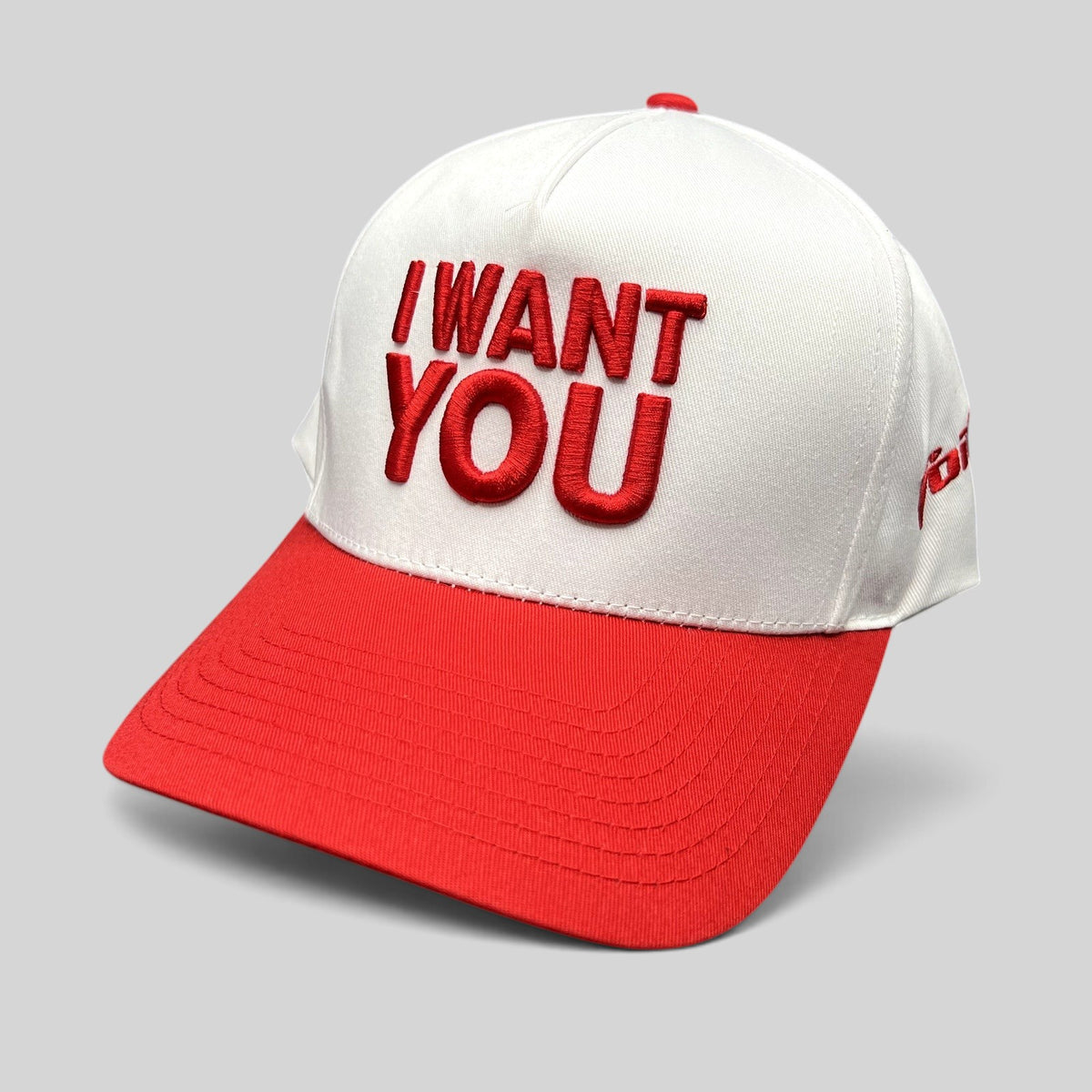 Raree Finds The Voice I Want You snapback hat with white crown, red brim, and bold raised red front embroidery.