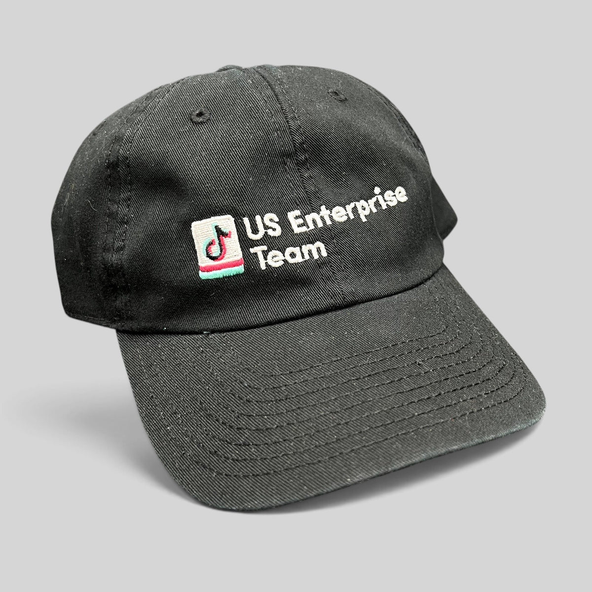 Raree Finds black TikTok US Enterprise Team strapback hat with embroidered logo on a structured crown