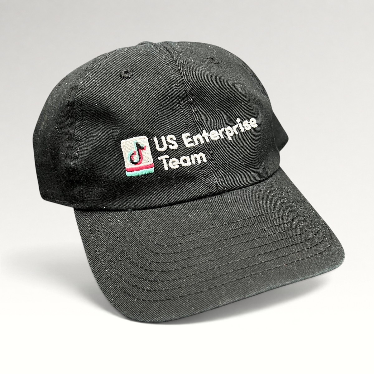 Raree Finds black TikTok US Enterprise Team strapback hat with embroidered logo on a structured crown