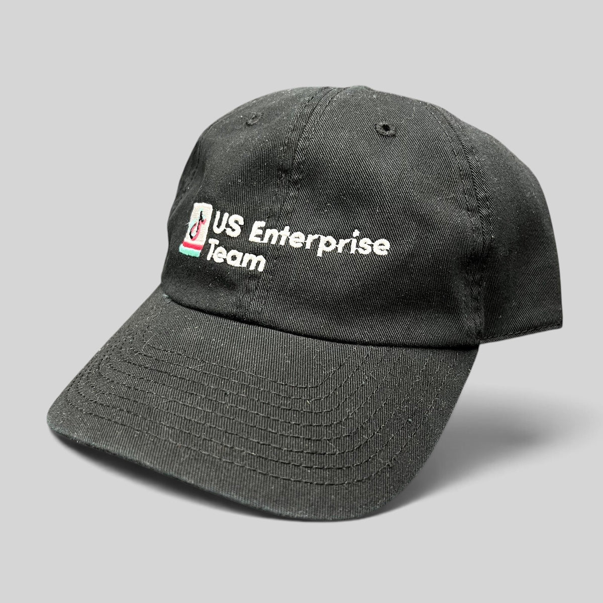 Raree Finds black TikTok US Enterprise Team strapback hat with embroidered logo on a structured crown and curved brim