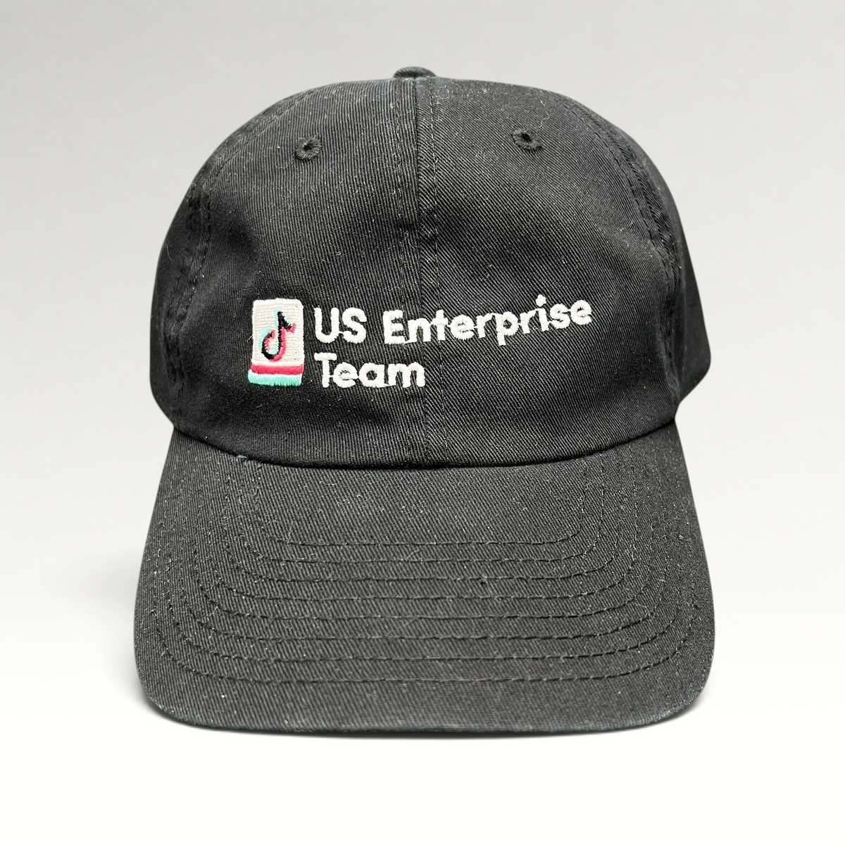 Raree Finds black TikTok US Enterprise Team strapback hat with embroidered logo on the front and curved brim