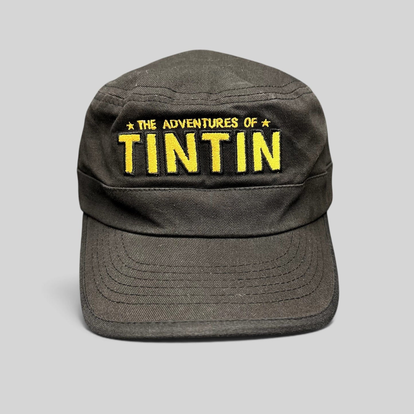 Raree Finds black 5-panel strapback hat with yellow embroidered The Adventures of Tintin movie logo