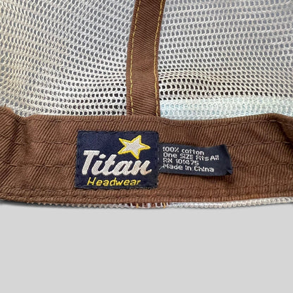 Raree Finds Titan Headwear label inside a brown cotton and white mesh trucker hat with care instructions