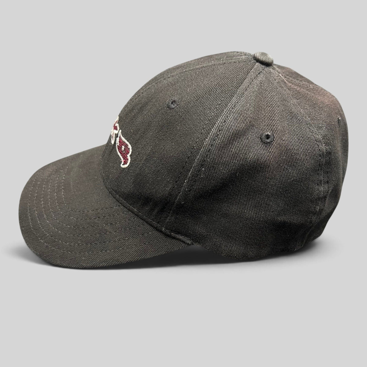 Raree Finds youth fitted black Tony Hawk skate hat with embroidered HAWK wordmark and bird logo in red and white.