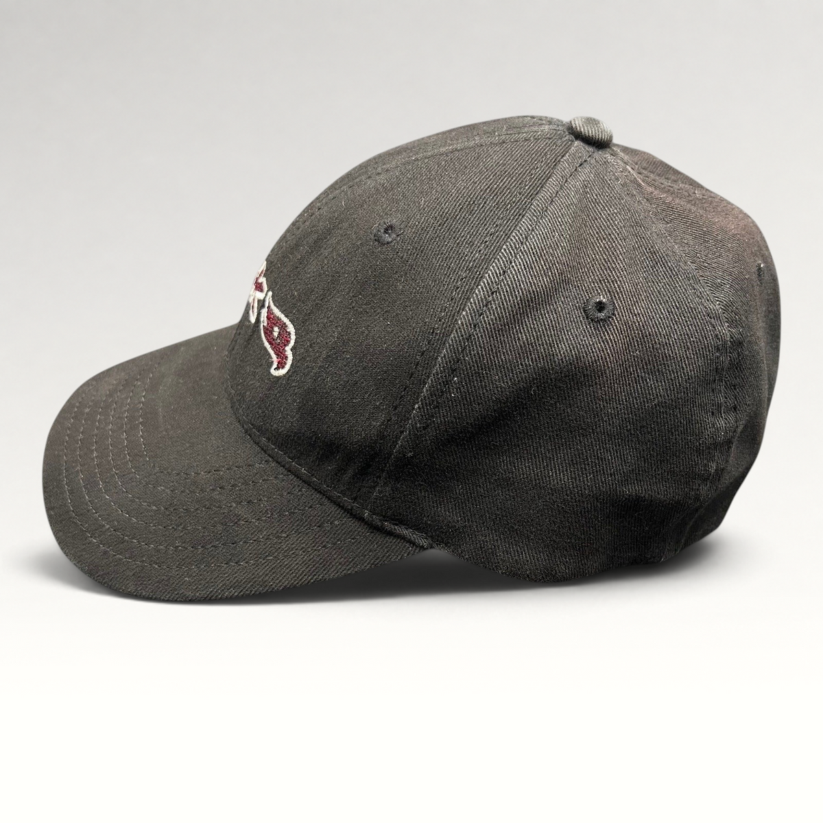 Raree Finds youth fitted black Tony Hawk skate hat with embroidered HAWK wordmark and bird logo in red and white.