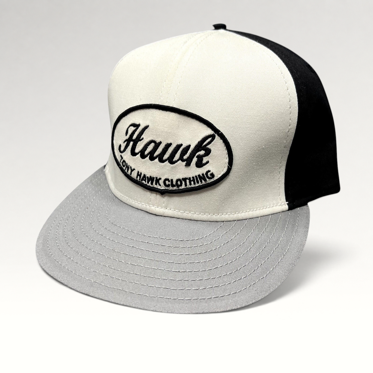 Raree Finds Tony Hawk Clothing black and white strapback hat with an embroidered oval Hawk script logo patch