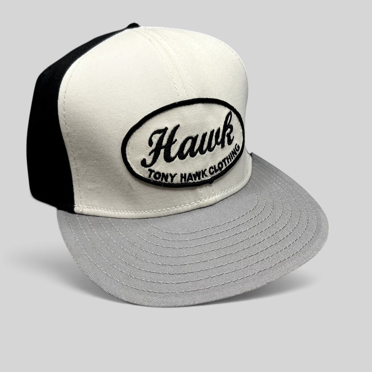 Raree Finds Tony Hawk Clothing strapback hat in black and white with an embroidered oval Hawk script logo patch.