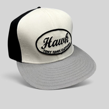 Raree Finds Tony Hawk Clothing strapback hat in black and white with an embroidered oval Hawk script logo patch.