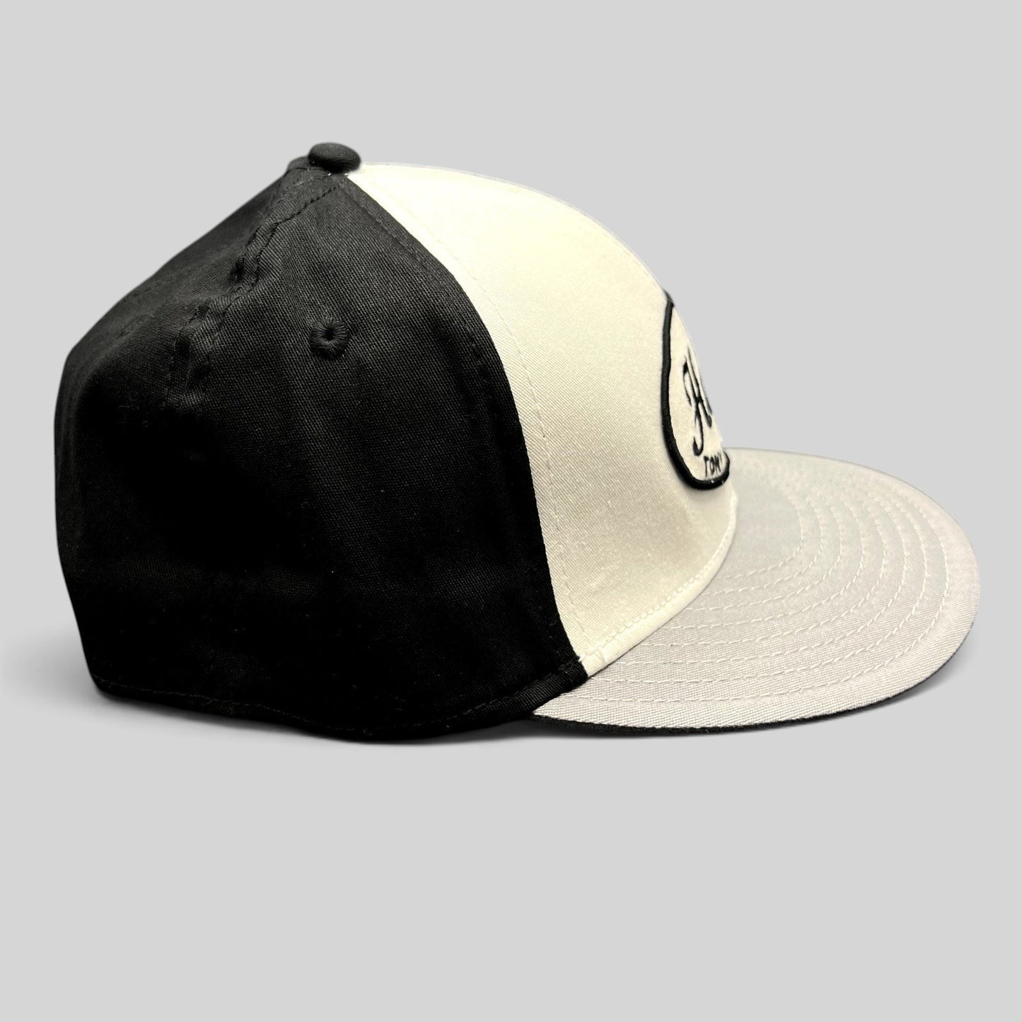 Raree Finds Tony Hawk Clothing black and white strapback hat with embroidered script logo on a curved bill