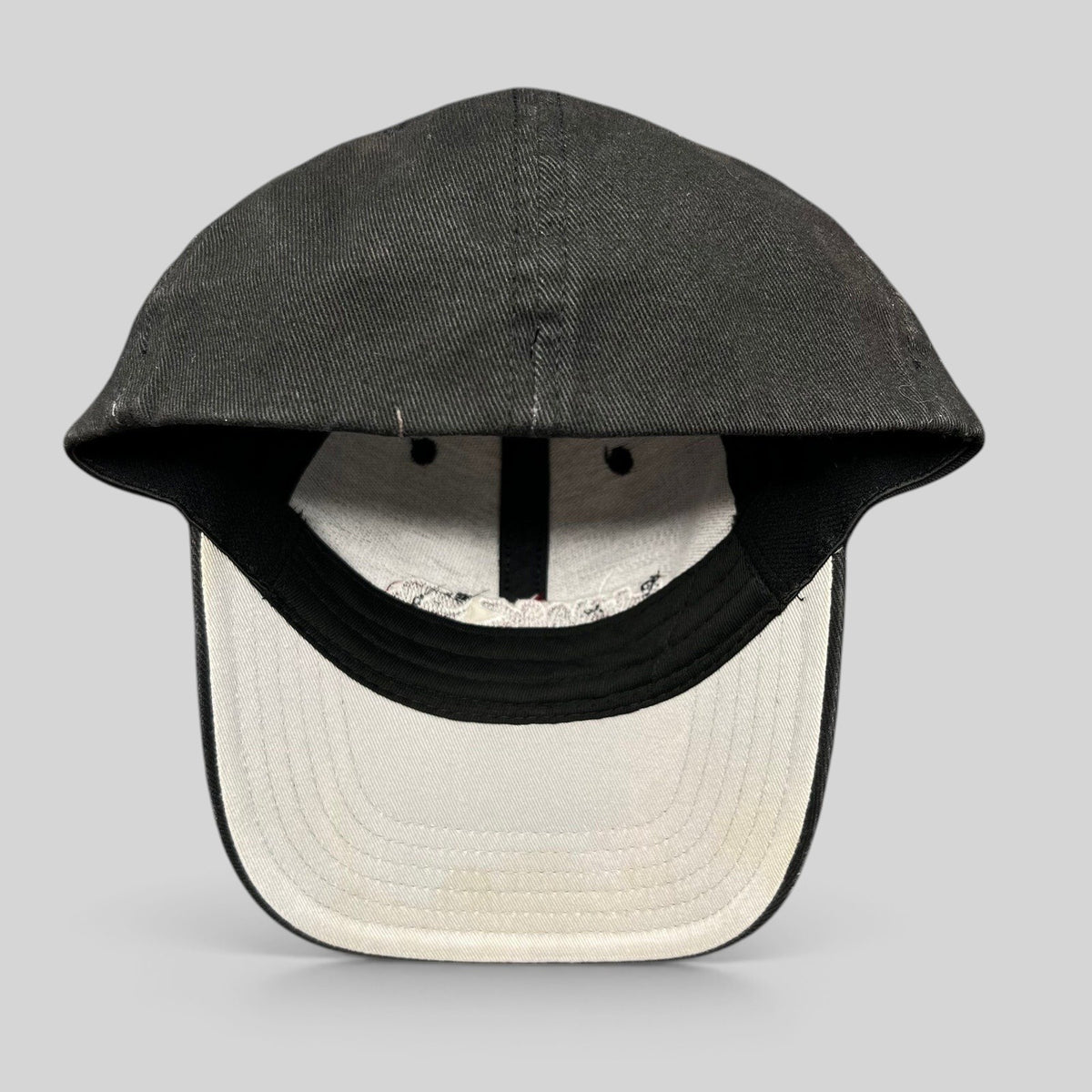 Raree Finds youth Tony Hawk fitted skate hat in black cotton with white interior lining and embroidered logo detail