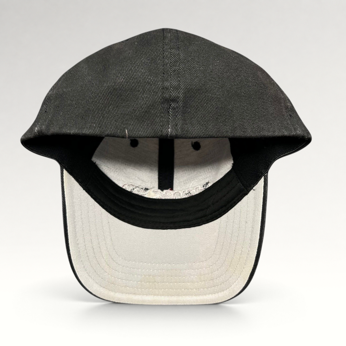 Raree Finds youth Tony Hawk fitted skate hat in black cotton with white interior lining and embroidered logo detail