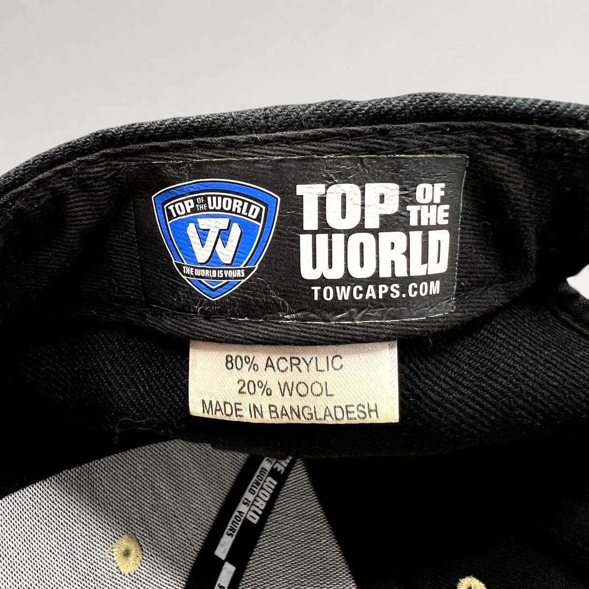 Raree Finds Top of the World hat interior label showing 80% acrylic and 20% wool material composition