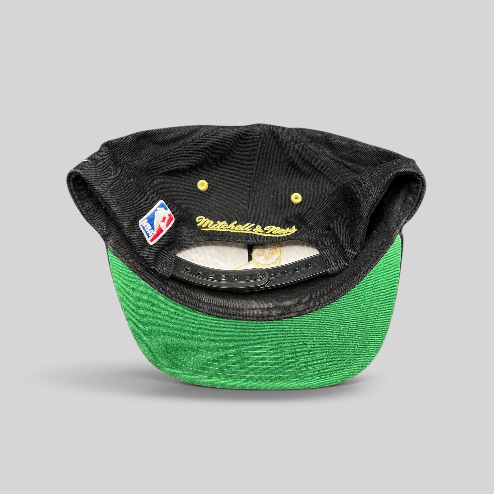Raree Finds Toronto Raptors x OVO Mitchell & Ness snapback showing the green underbrim, NBA patch, and rear branding.