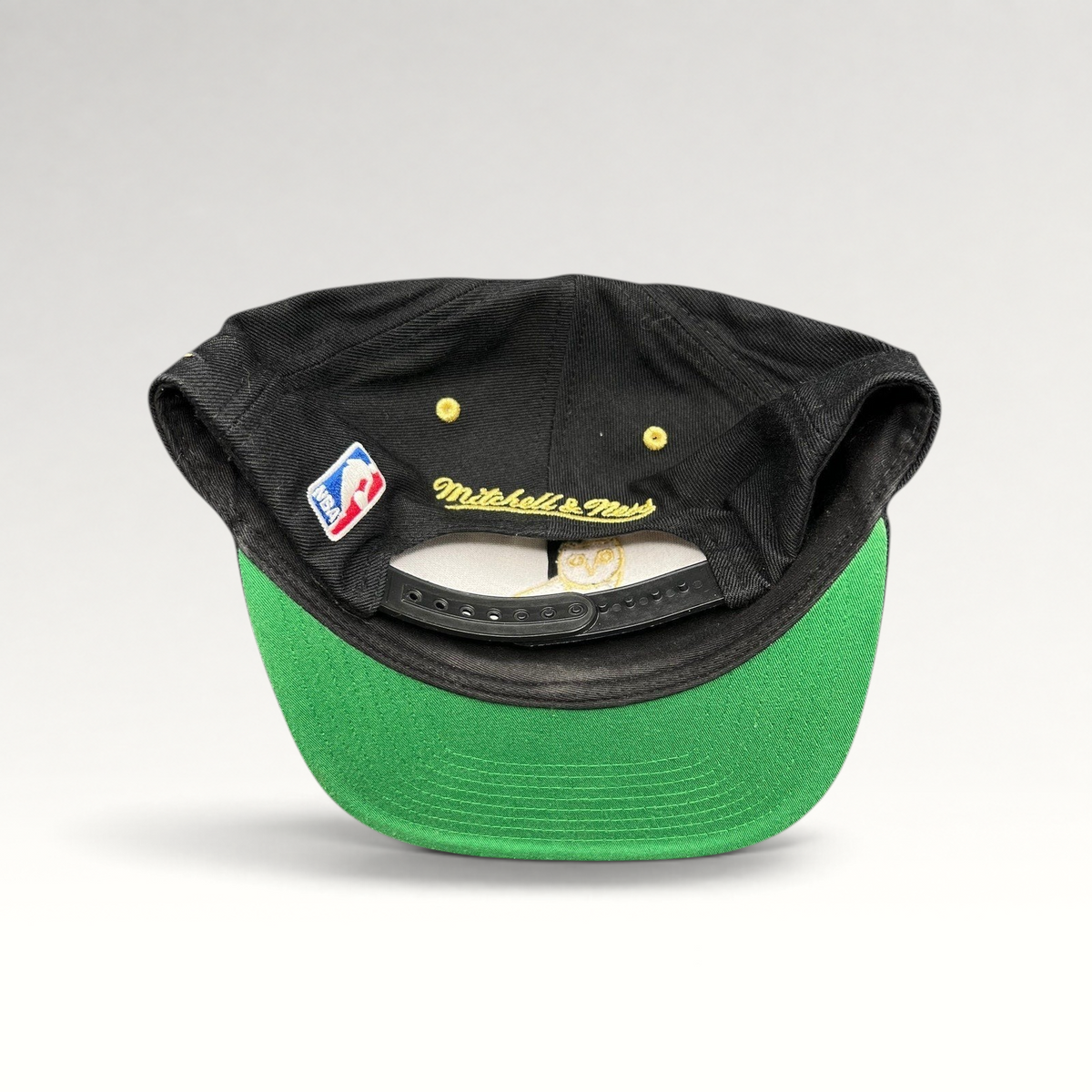 Raree Finds Toronto Raptors x OVO Mitchell & Ness snapback showing the green underbrim, NBA patch, and rear branding.