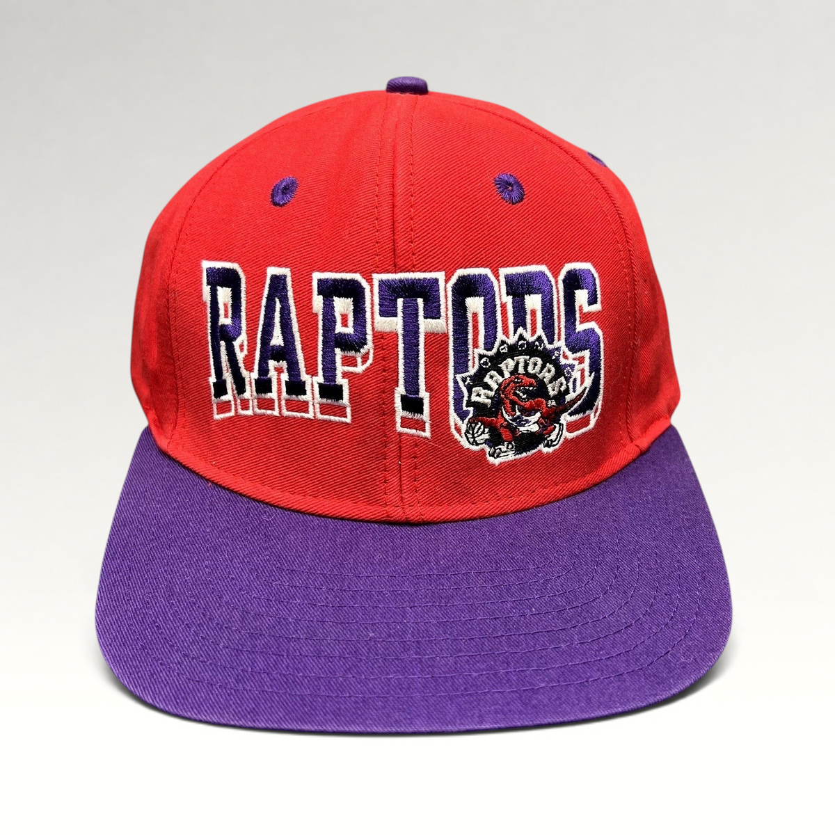 Raree Finds vintage Toronto Raptors Adidas Hardwood Classics snapback hat in red and purple with embroidered logo