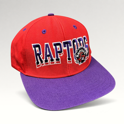 Raree Finds vintage Toronto Raptors Adidas Hardwood Classics snapback hat in red and purple with embroidered logo.