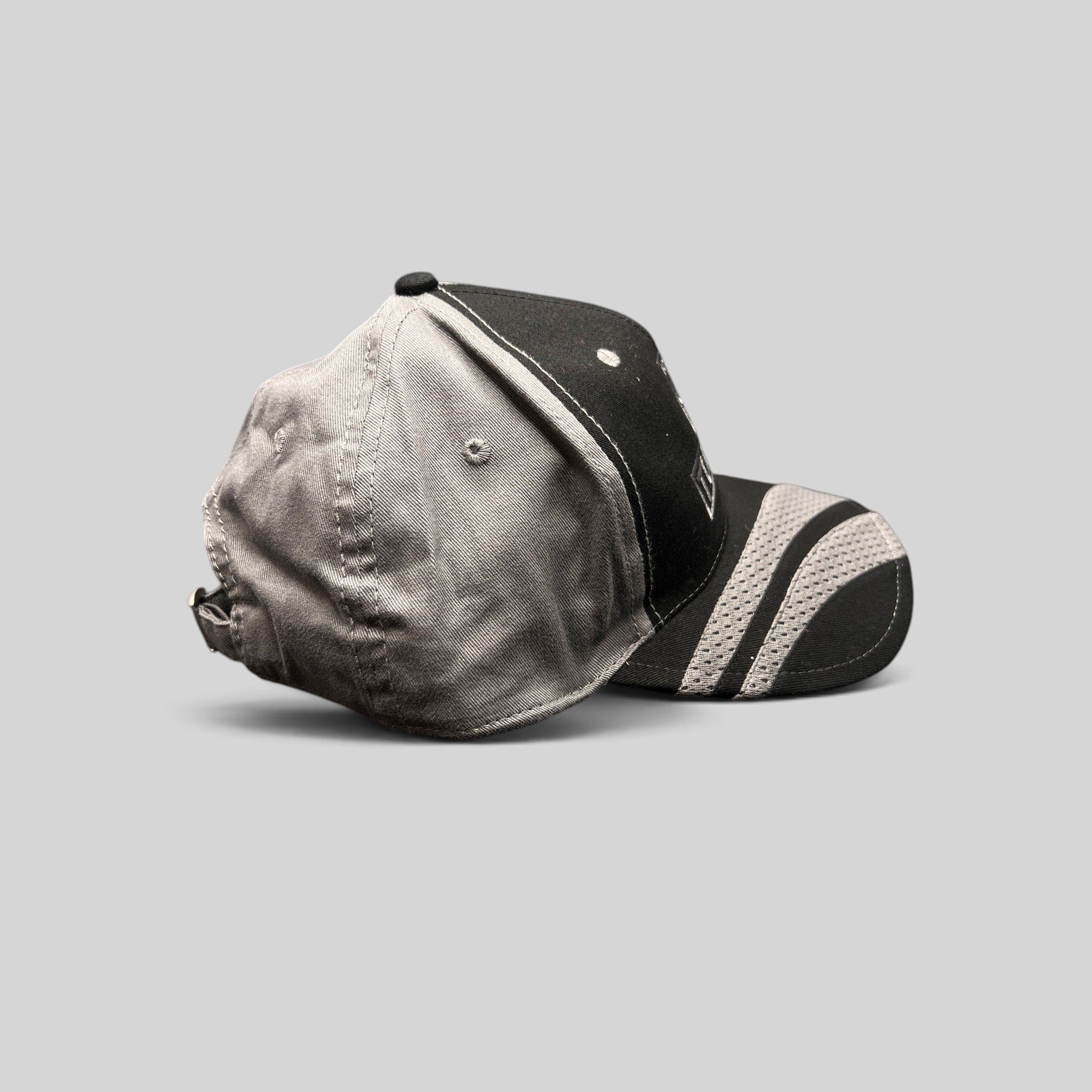 Raree Finds black and gray Toyota Tundra Trucks cap by Cobra with mesh-textured brim detail and adjustable strapback.