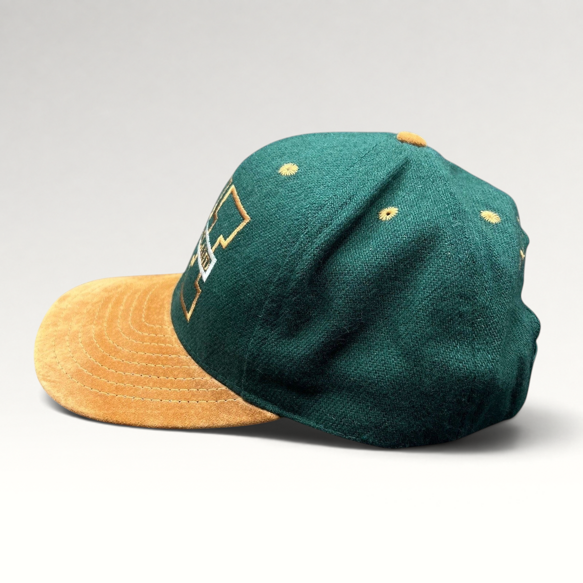 Raree Finds vintage Treasure Island Las Vegas snapback hat with green wool crown and tan suede brim