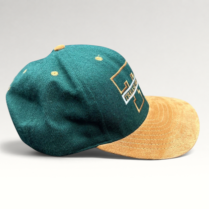 Raree Finds vintage Treasure Island Las Vegas snapback hat with a green wool crown and tan suede brim.