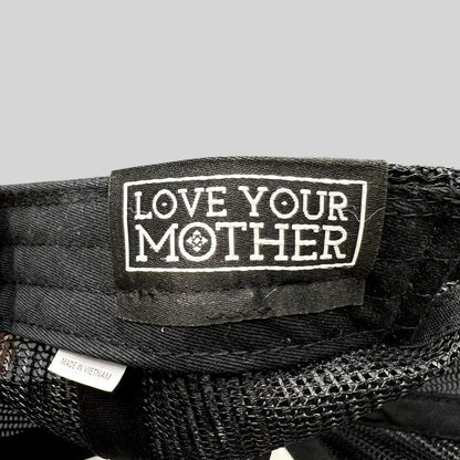 Raree Finds black trucker hat interior tag reading Love Your Mother with a Made in Vietnam label