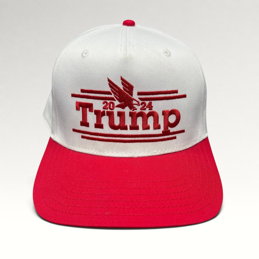 Raree Finds Trump 2024 snapback hat with white crown, red bill, and red embroidered eagle logo on front panel.