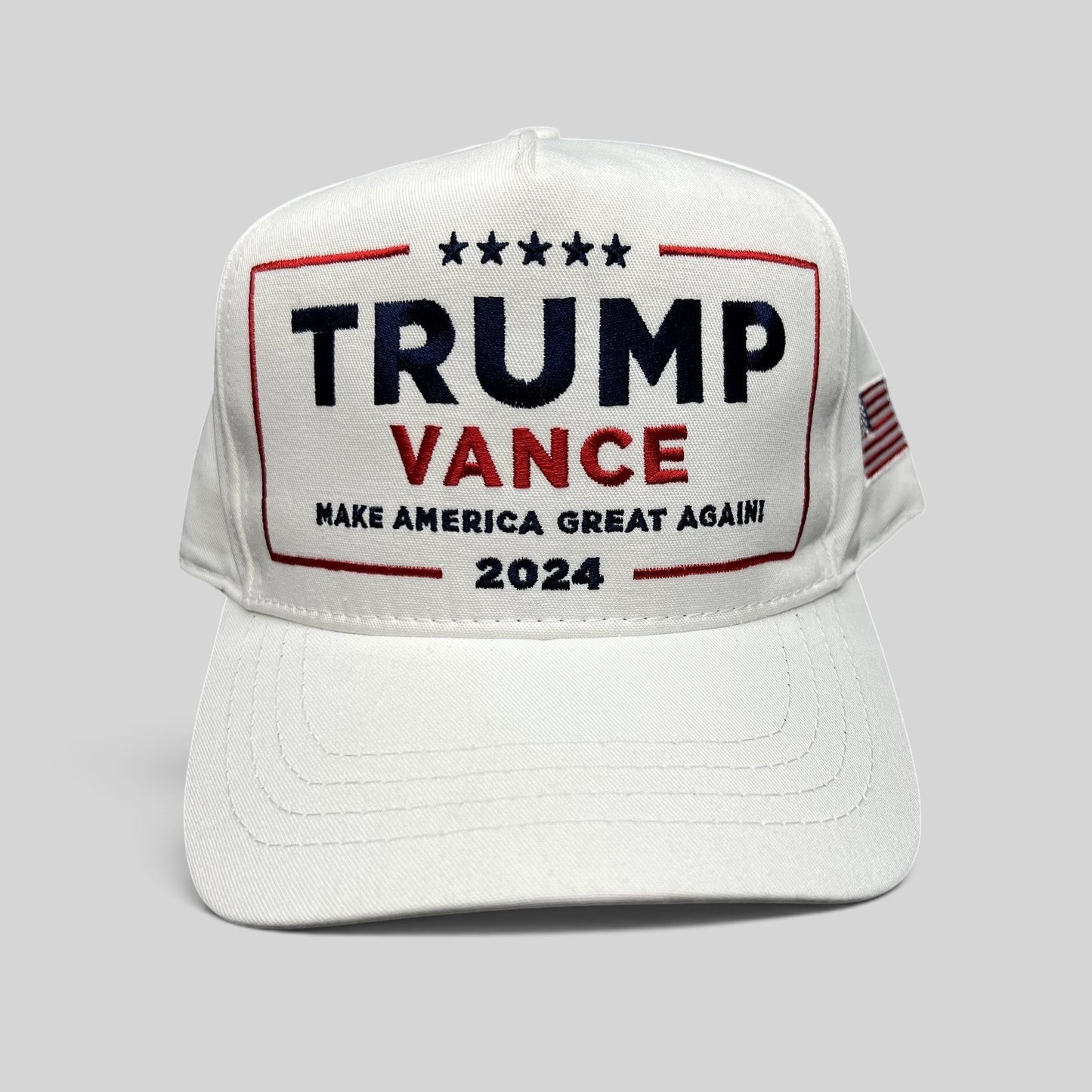 Raree Finds white Trump Vance 2024 snapback hat with red, white, and blue embroidered campaign slogan and flag detail.