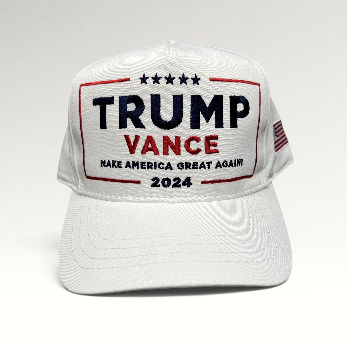 Raree Finds white Trump Vance 2024 snapback hat with red, white, and blue embroidered campaign slogan and flag detail.