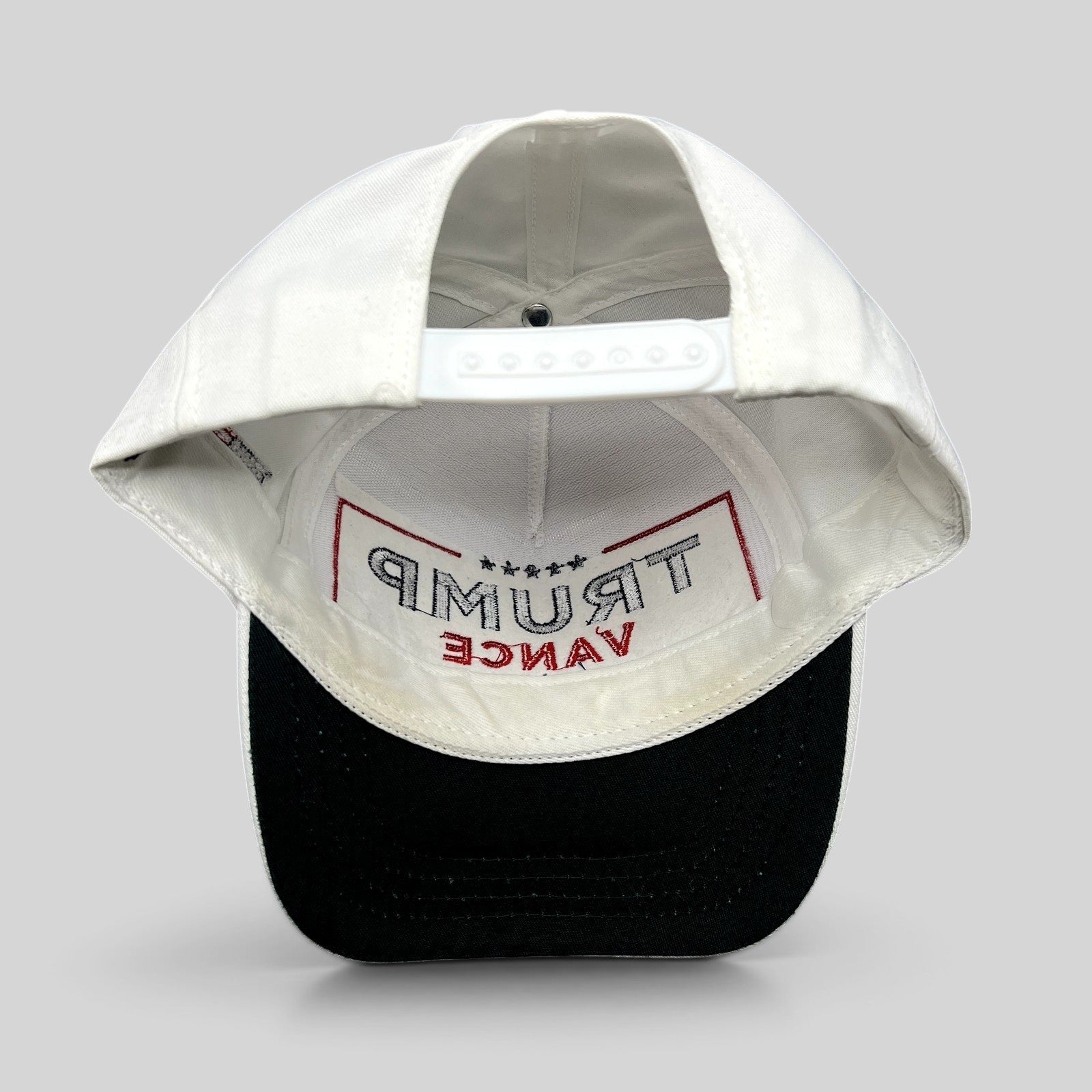 Raree Finds Trump Vance 2024 snapback hat interior view showing white structured crown and black brim