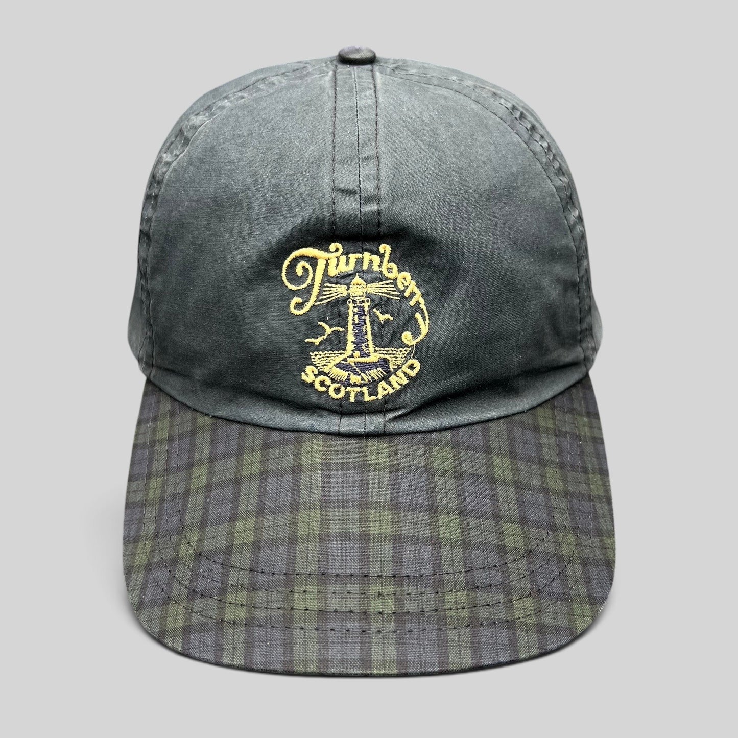 Raree Finds vintage Turnberry Scotland golf hat in navy with an embroidered lighthouse logo and Black Watch tartan bill