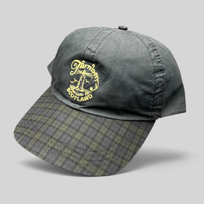 Raree Finds vintage Turnberry Scotland golf hat in dark navy with an embroidered lighthouse logo and tartan bill.