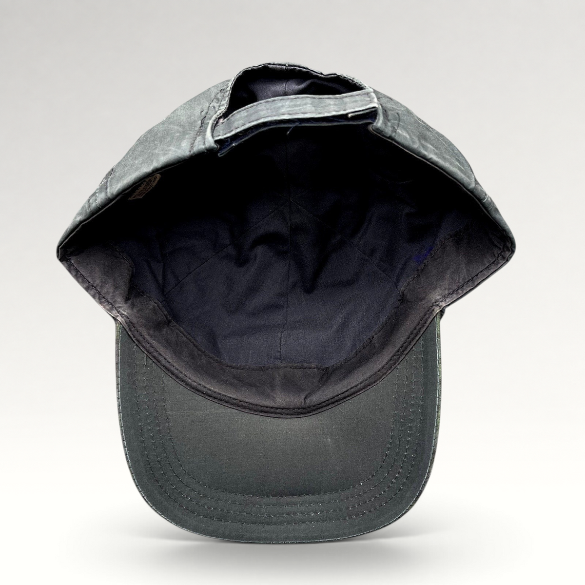 Raree Finds vintage Turnberry Scotland golf hat with a dark navy crown and Black Watch tartan plaid bill interior.