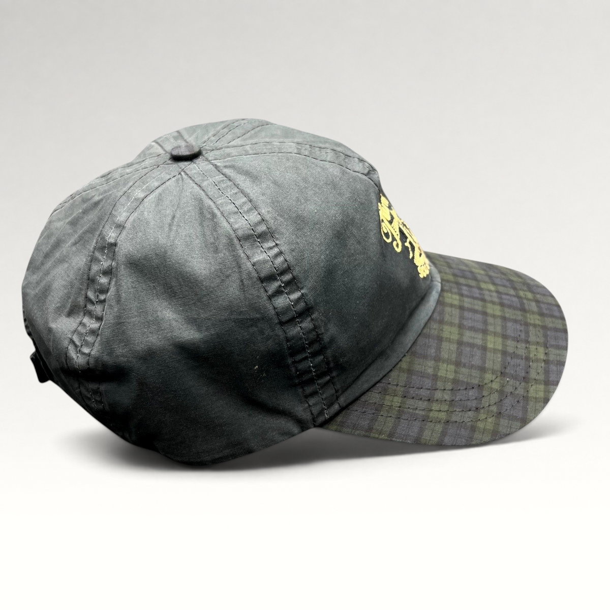 Raree Finds vintage Turnberry Scotland golf hat in dark navy with a Black Watch tartan plaid bill and lighthouse logo.