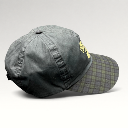 Raree Finds vintage Turnberry Scotland golf hat in dark navy with a Black Watch tartan plaid bill and lighthouse logo.