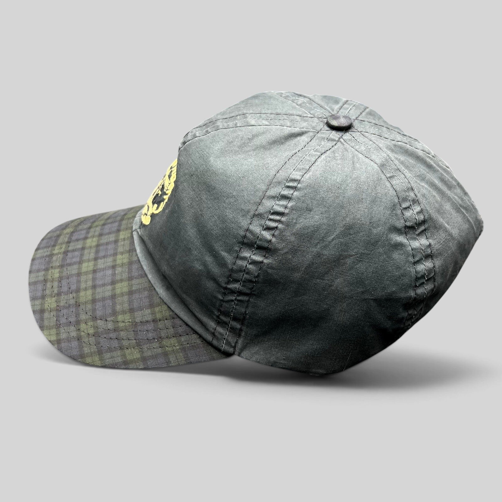 Raree Finds vintage Turnberry Scotland golf hat in dark navy with a Black Watch tartan plaid bill and lighthouse logo.