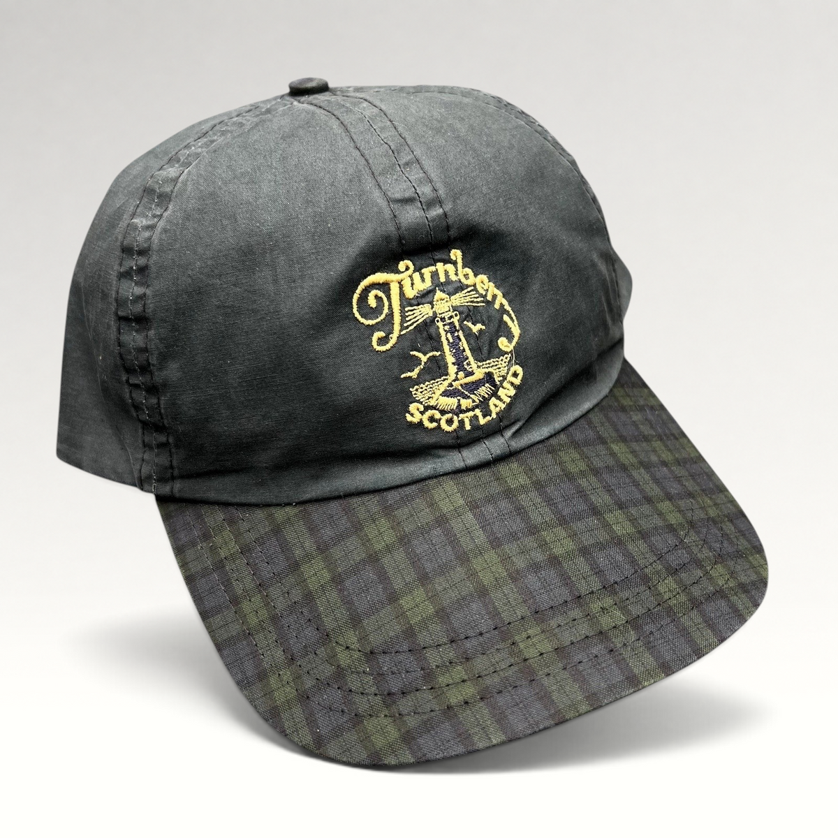 Raree Finds vintage Turnberry Scotland golf hat in dark navy with embroidered lighthouse logo and tartan plaid bill.