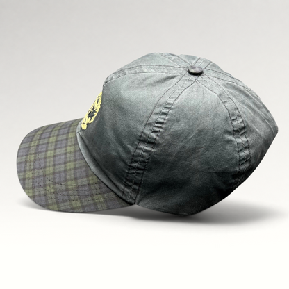 Raree Finds vintage Turnberry Scotland golf hat in dark navy with a Black Watch tartan plaid bill and lighthouse logo.