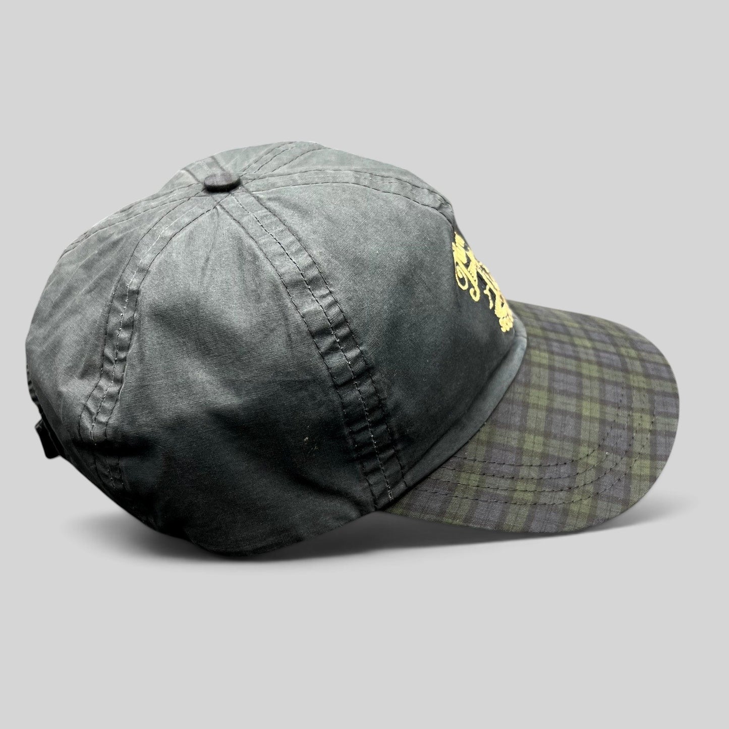 Raree Finds vintage Turnberry Scotland golf hat in dark navy with a Black Watch tartan plaid bill and lighthouse logo.