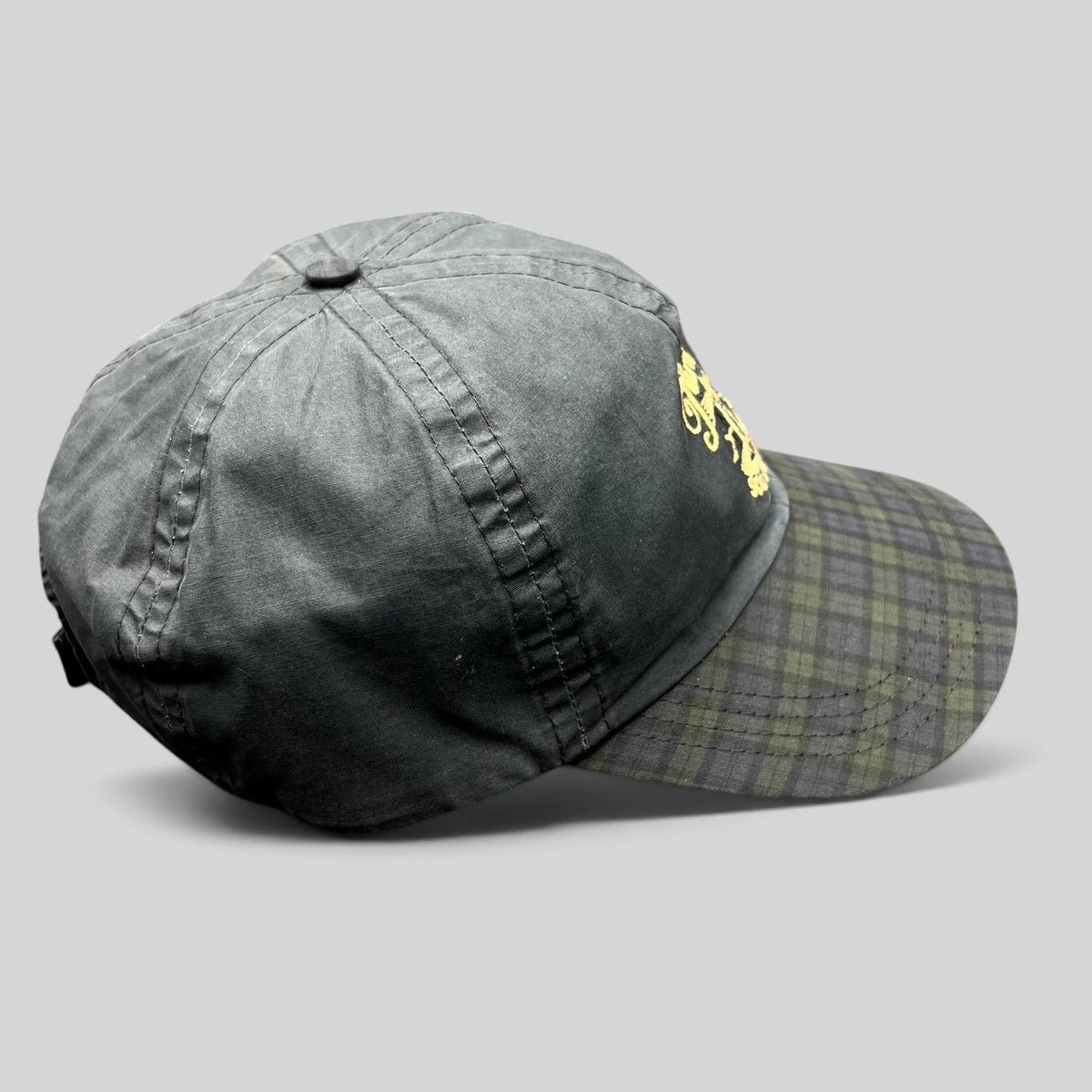 Raree Finds vintage Turnberry Scotland golf hat in dark navy with a Black Watch tartan plaid bill and lighthouse logo.