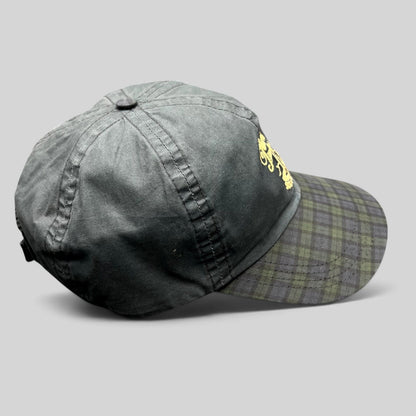 Raree Finds vintage Turnberry Scotland golf hat in dark navy with a Black Watch tartan plaid bill and lighthouse logo.