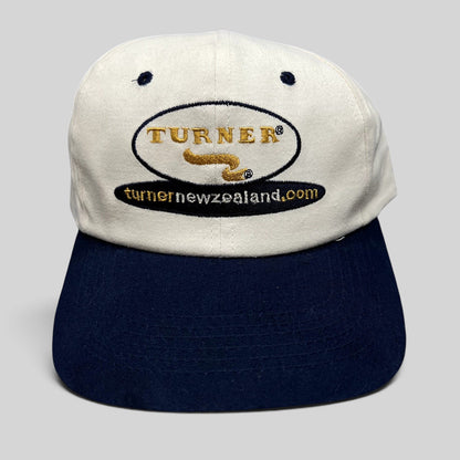 Raree Finds vintage Turner New Zealand snapback hat with white cotton crown, navy brim, and embroidered logo.