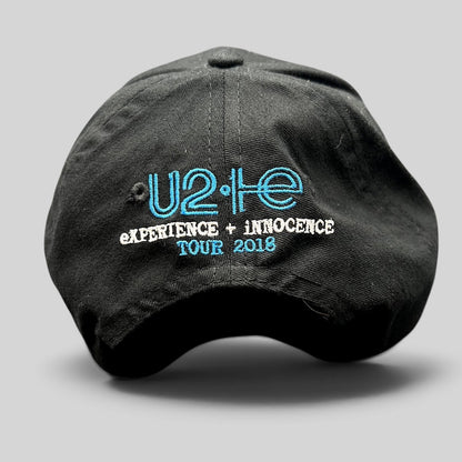 Raree Finds black U2 eXPERIENCE + iNNOCENCE Tour 2018 strapback hat with blue and white embroidered rear logo