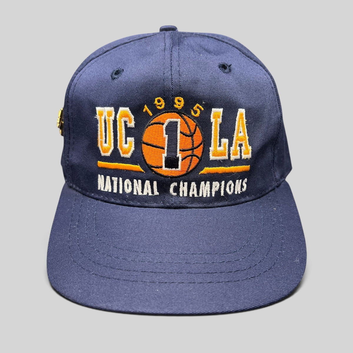 Raree Finds vintage 1995 UCLA Bruins National Champions navy blue snapback hat with embroidered basketball graphic