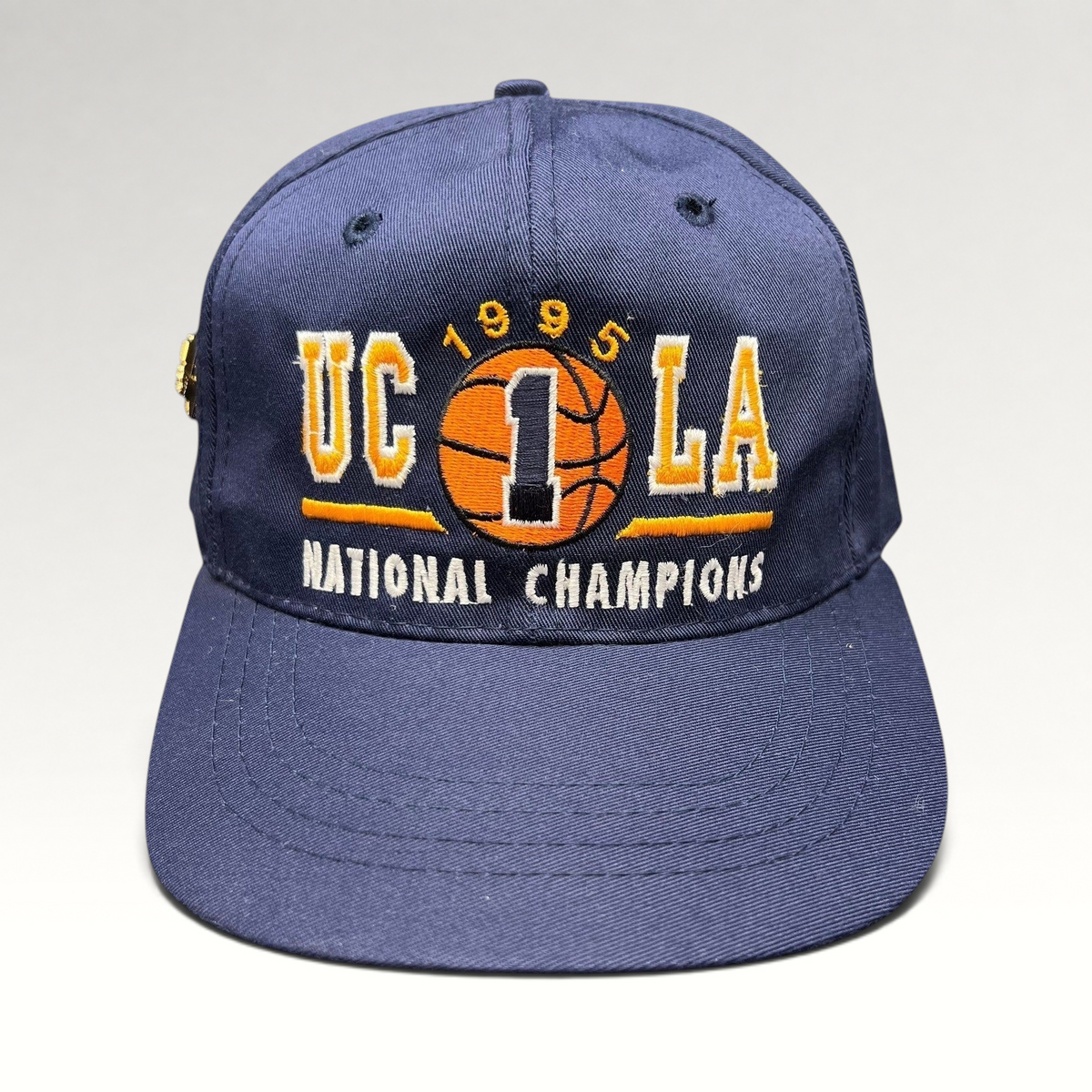 Raree Finds vintage 1995 UCLA Bruins National Champions navy blue snapback hat with embroidered basketball graphic